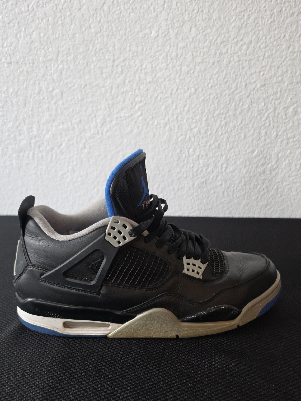 Jordan Men’s Black and Blue Air Jordan 4 Retro